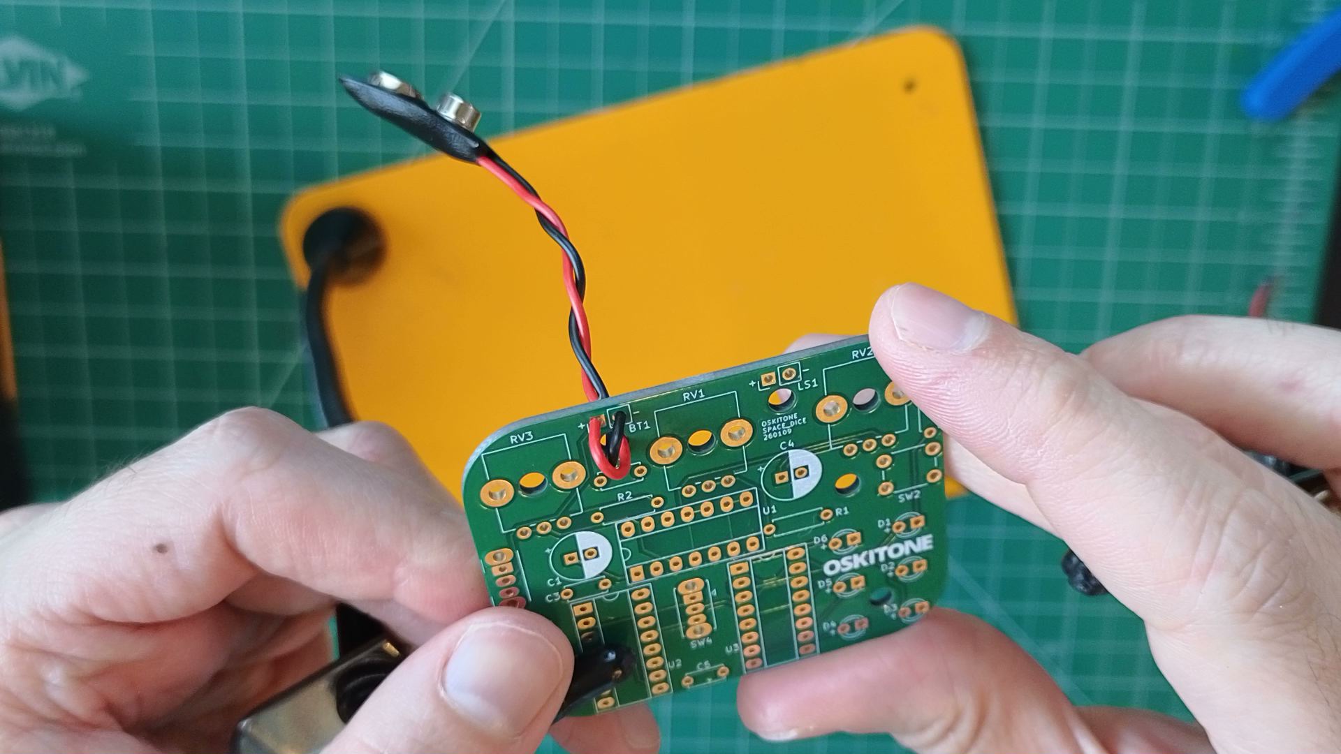 battery wires through relief hole