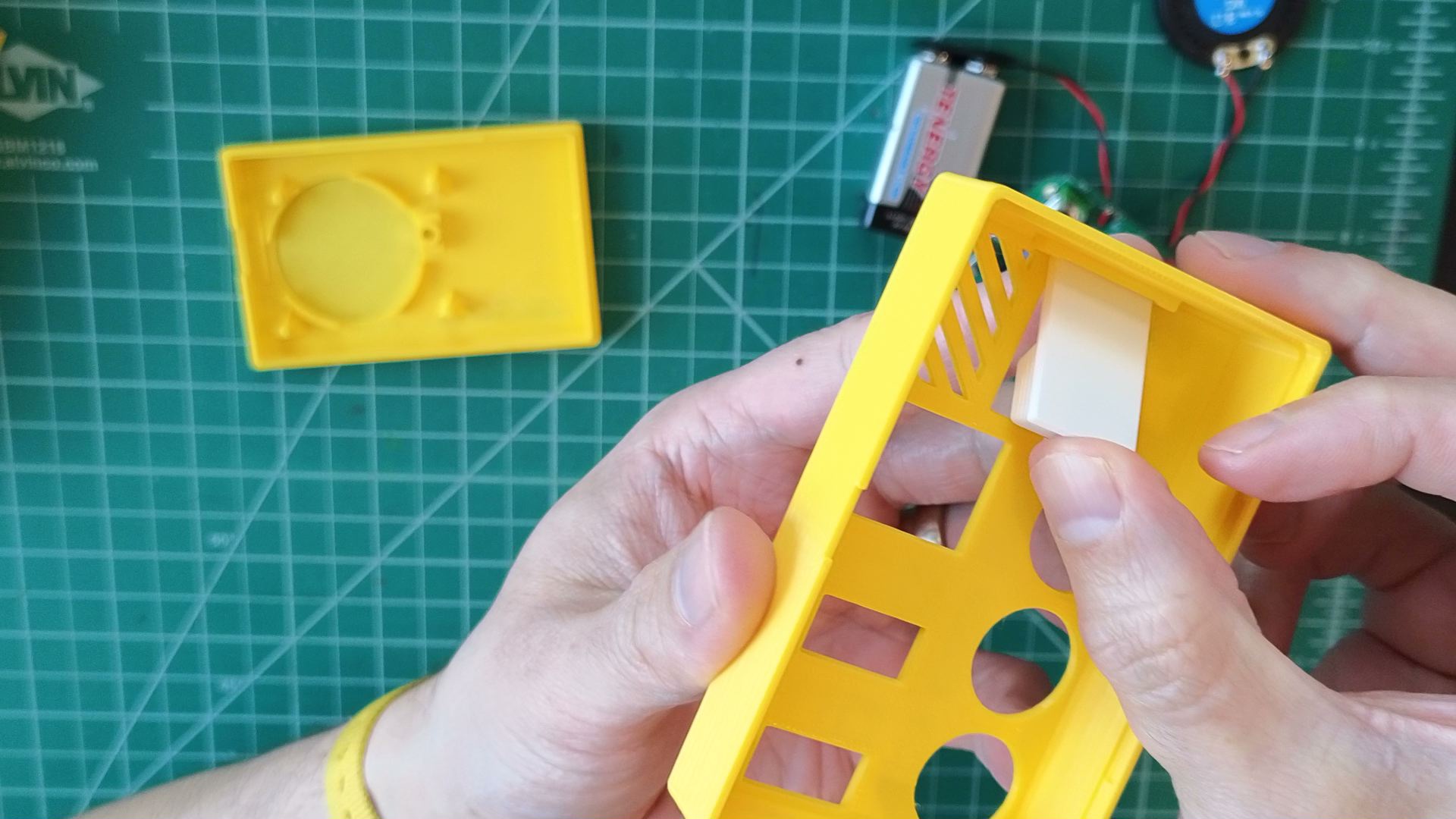 button cap in enclosure top fixture