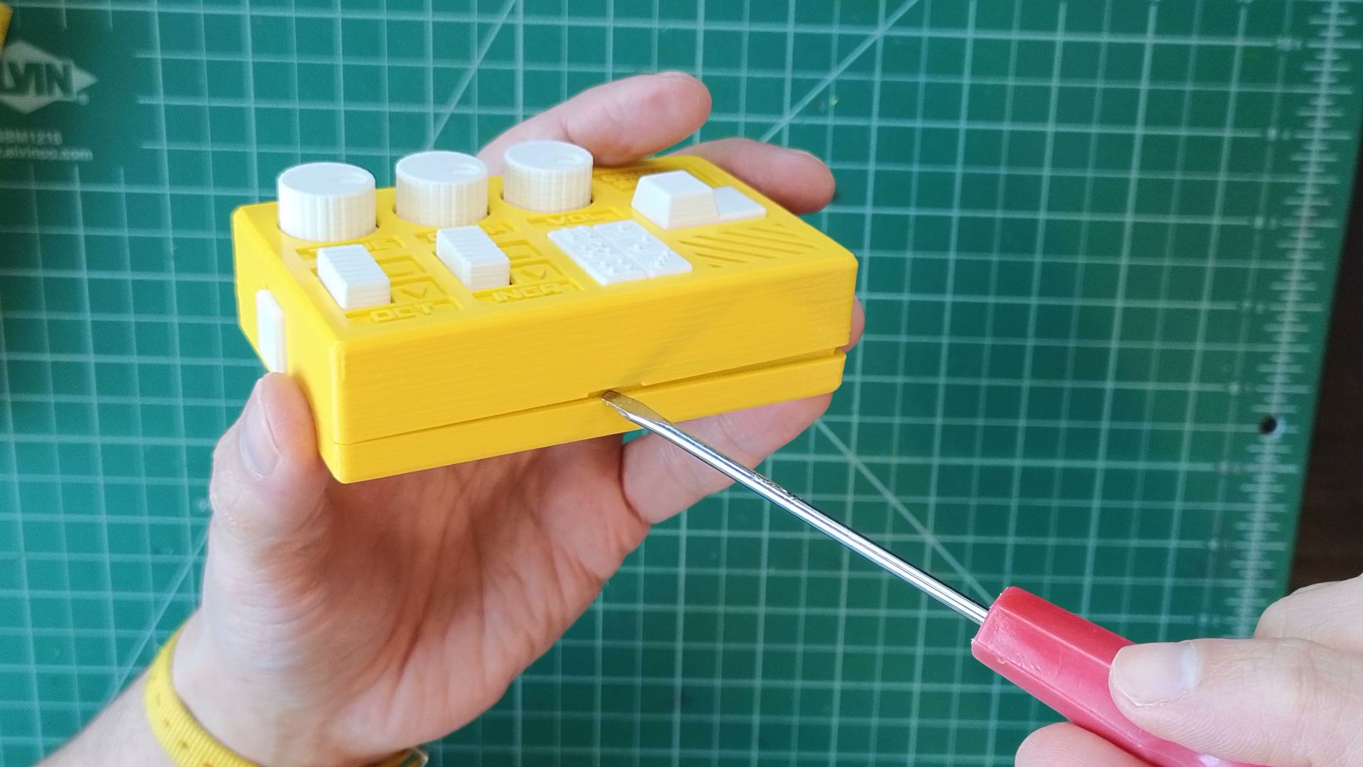 using flat tool to open enclosure